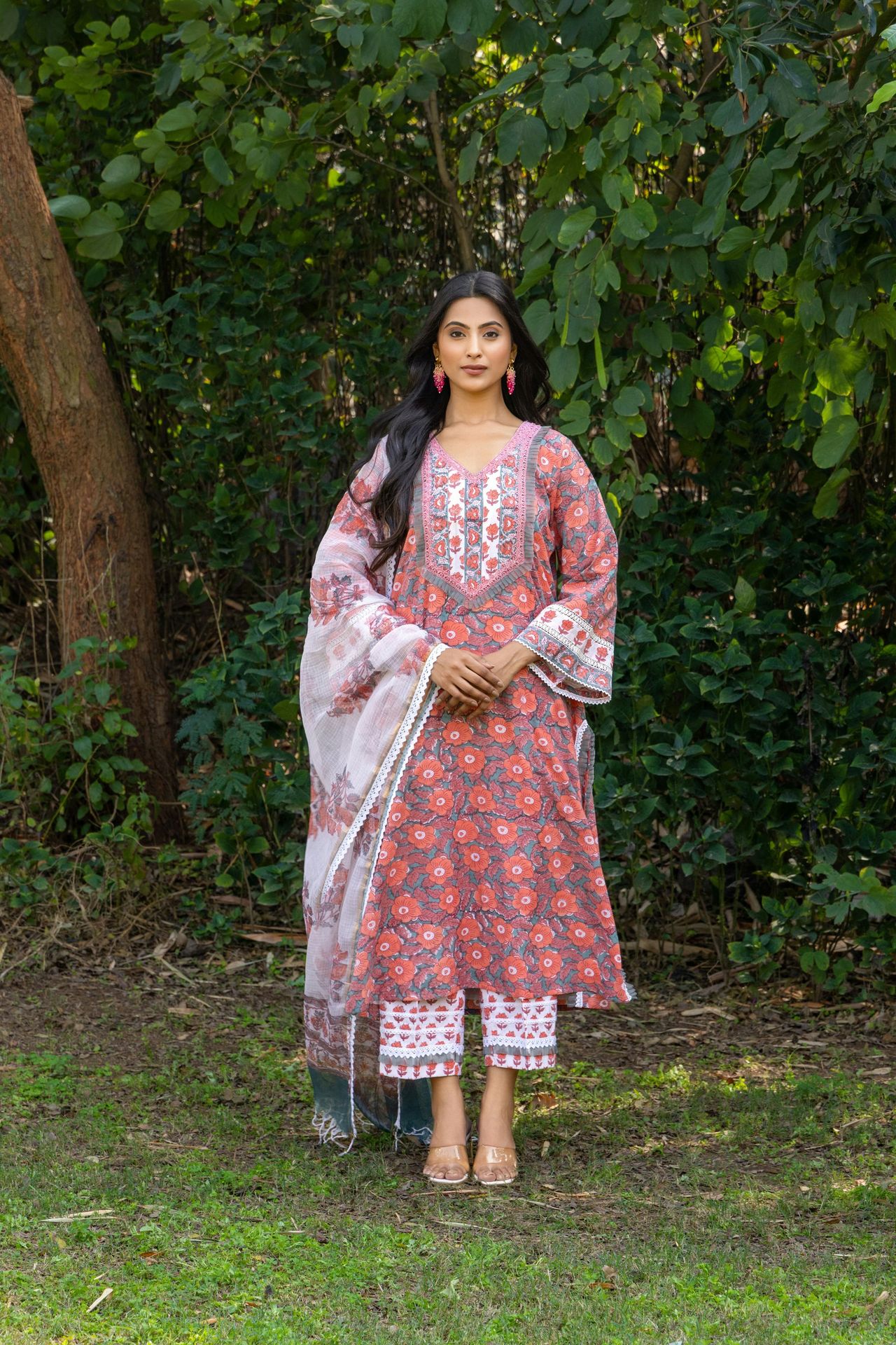 Woman wearing a traditional indian outfit outdoors.